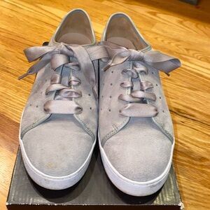 Bionic light grey suede tennis shoes .